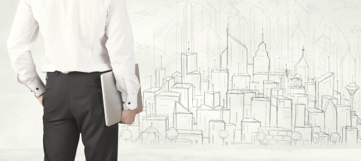 persona con su portátil delante del dibujo de una ciudad con empleo público