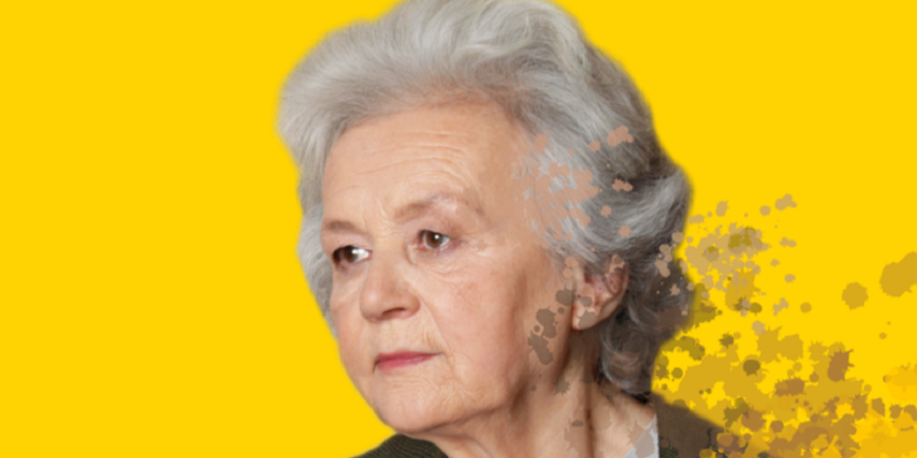 mujer mayor llevándose la mano al pecho mientras mira al frente. fondo de color amarillo