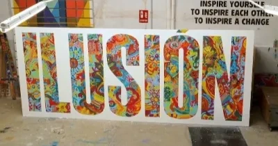 una pancarta con la palabra "ILUSIÓN"