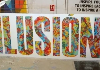 una pancarta con la palabra "ILUSIÓN"